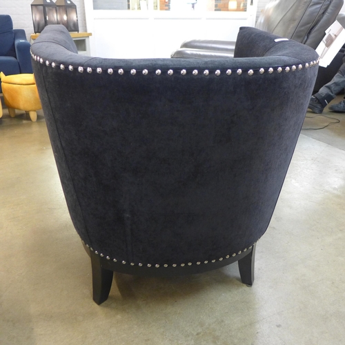 1353 - A black velvet studded armchair