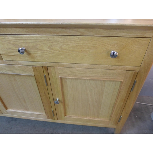 1377 - A Bergen rustic oak two drawer three door sideboard, damage to backboard * this lot is subject to VA... 