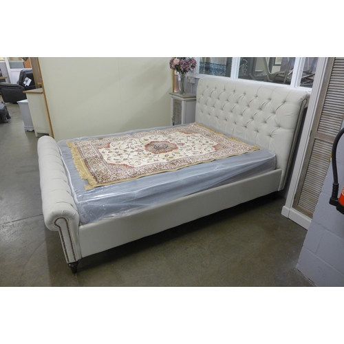 1397 - An oatmeal buttoned kingsize bed frame