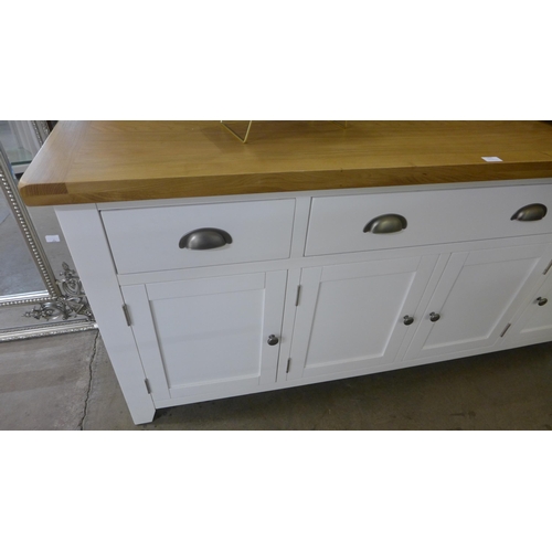 1436 - A Hampshire white painted oak large four drawer four door sideboard * this lot is subject to VAT