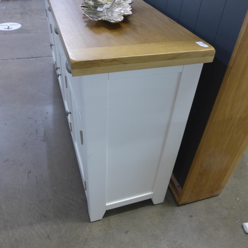 1436 - A Hampshire white painted oak large four drawer four door sideboard * this lot is subject to VAT