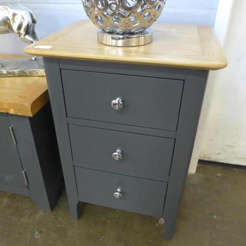 1466 - A Salisbury blue and oak painted three drawer bedside cabinet *This Lot is Subject to VAT*