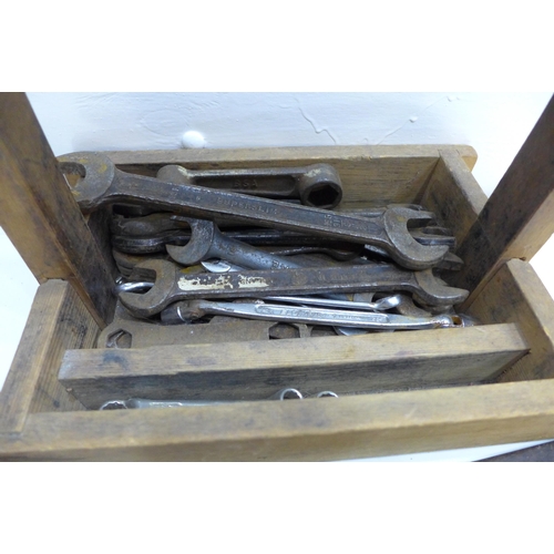 2029 - A collection of tools including spanners, saw and woodworking planes