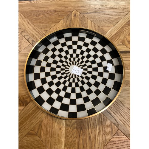 1690 - A large circular black and white chequers design tray, 44cms