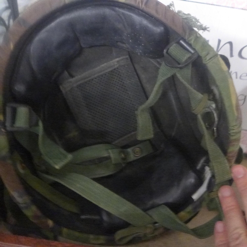 2289 - NATO Military issue army helmet, heavy and solid with camouflage and chinstrap, NATO tag inside helm... 