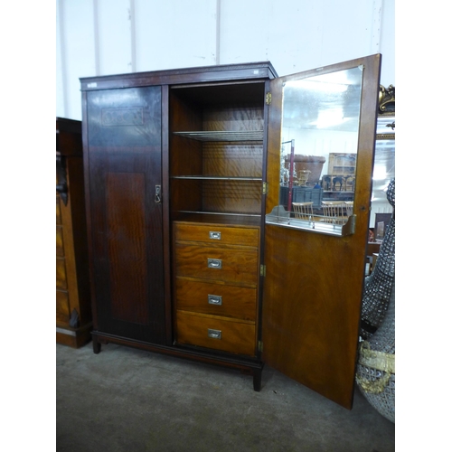 27 - An Art Deco inlaid mahogany fitted compactum style wardrobe