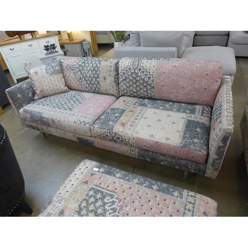 1366 - A designer pink and cream upholstered four seater sofa