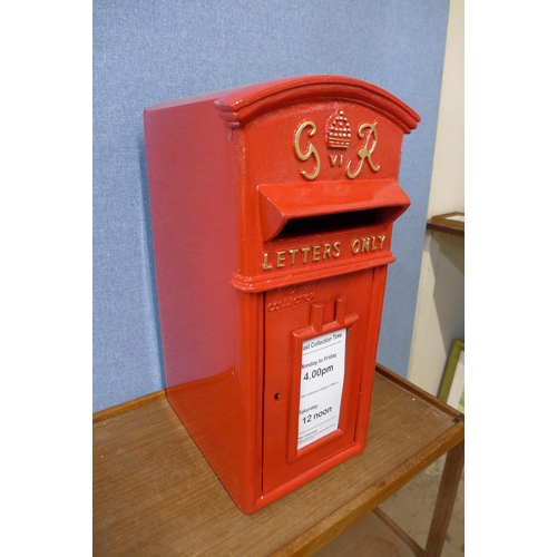 372 - A red metal Post Office post box, with key