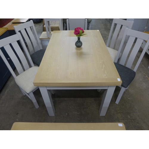 1402 - A Chichester extending table and four chairs