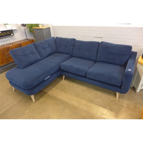 1435 - A blue velvet upholstered corner sofa