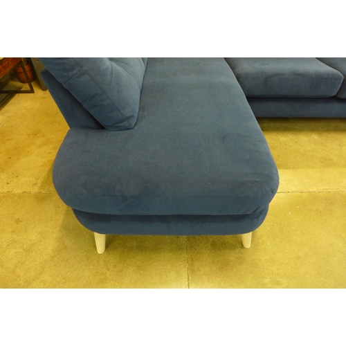 1435 - A blue velvet upholstered corner sofa