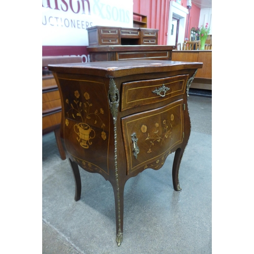 10 - A 19th Century French marquetry inlaid mahogany and gilt metal mounted bombe shaped petit commode