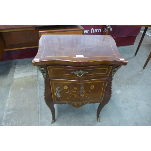 10 - A 19th Century French marquetry inlaid mahogany and gilt metal mounted bombe shaped petit commode