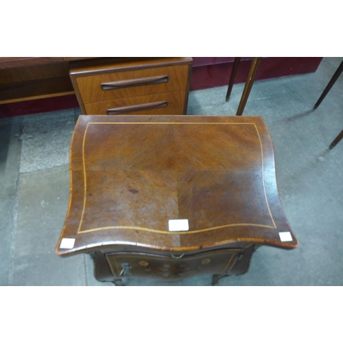 10 - A 19th Century French marquetry inlaid mahogany and gilt metal mounted bombe shaped petit commode