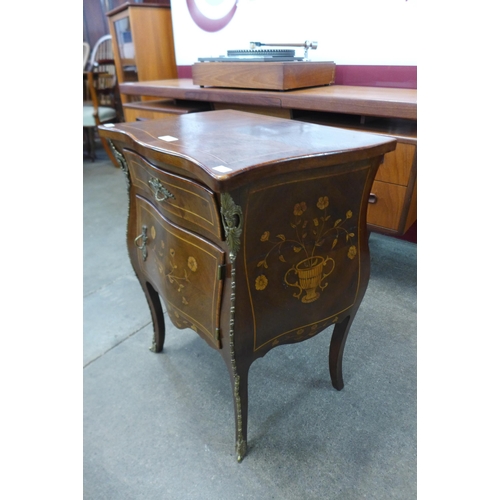 10 - A 19th Century French marquetry inlaid mahogany and gilt metal mounted bombe shaped petit commode