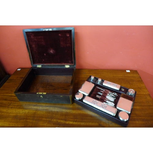 11 - A Regency coromandel and brass inlaid lady's sewing box, with silver mounted glass bottles