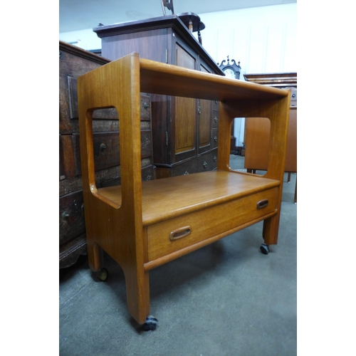 115 - A teak single drawer trolley