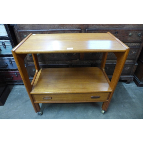 115 - A teak single drawer trolley