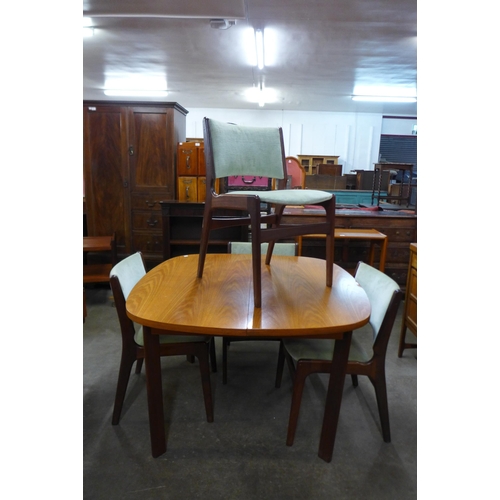 116 - A G-Plan teak extending dining table and four Danish Erik Buch teak dining chairs