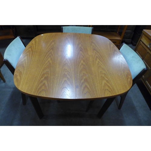 116 - A G-Plan teak extending dining table and four Danish Erik Buch teak dining chairs