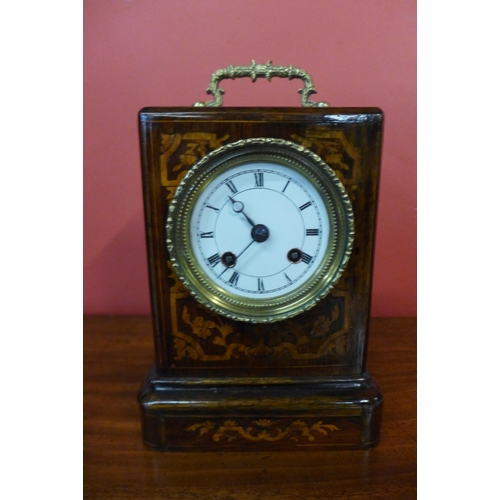 12 - A 19th Century French inlaid rosewood mantel clock, movement signed Louis et Miera, Paris