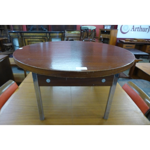 121 - A teak circular coffee table