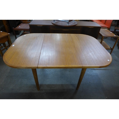 122 - A Danish teak extending dining table