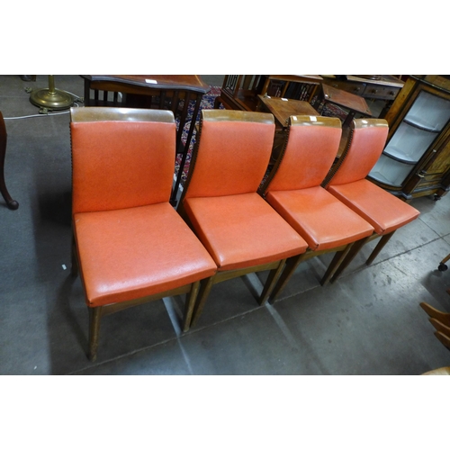 123 - A set of four teak dining chairs