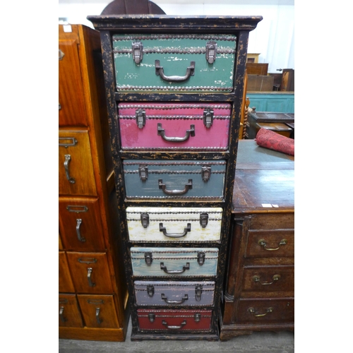 137 - A painted suitcase chest of drawers