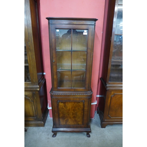 17 - A George I style walnut two door display cabinet