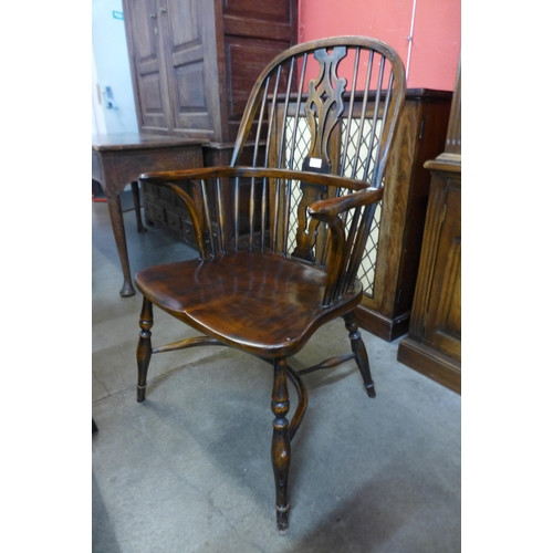 19 - A pair of elm and beech Windsor armchairs