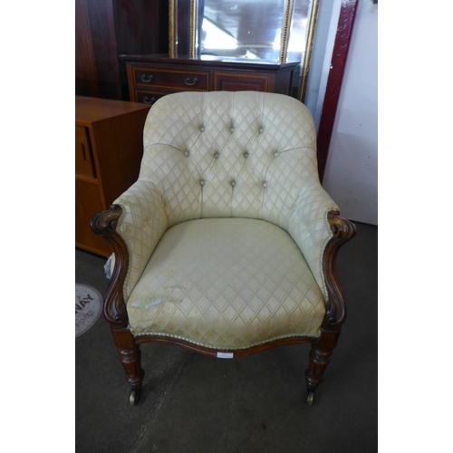 24 - A William IV rosewood and fabric upholstered armchair