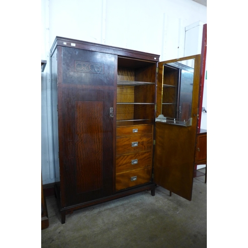 27 - An Art Deco inlaid mahogany fitted compactum style wardrobe