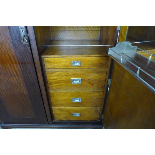 27 - An Art Deco inlaid mahogany fitted compactum style wardrobe