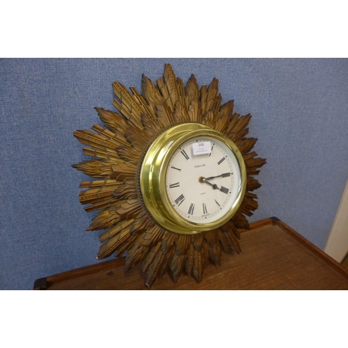 348 - A Baskerville sunburst wall clock, a/f