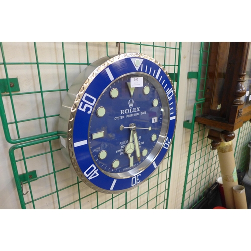 360 - A Rolex style dealer's display circular wall clock