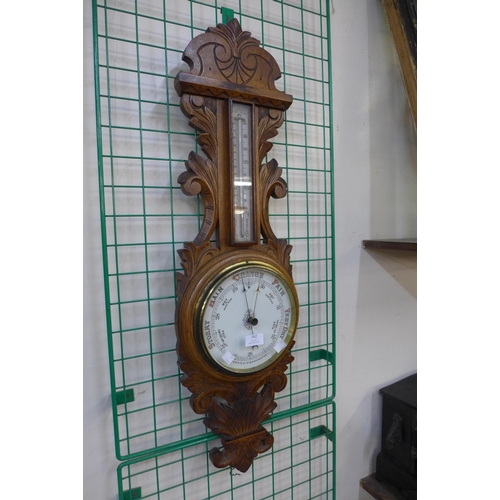 362 - A Victorian carved oak aneroid barometer