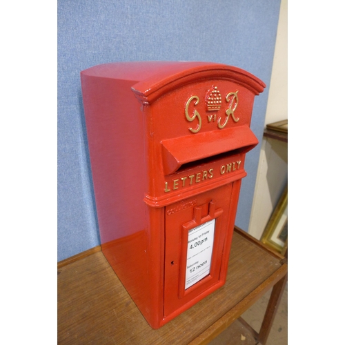 372 - A red metal Post Office post box, with key