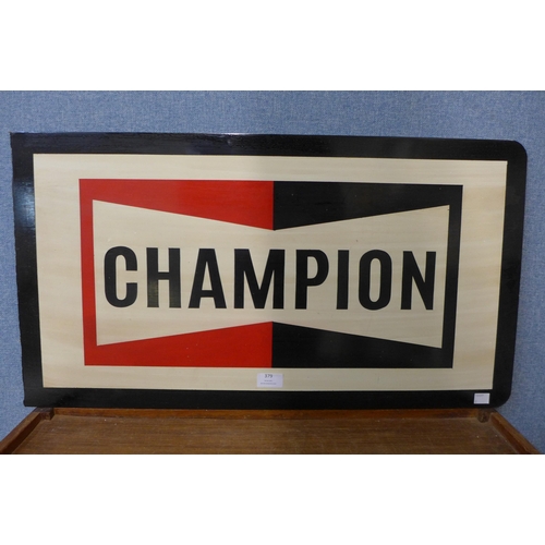 379 - A reproduction Champion painted tin sign