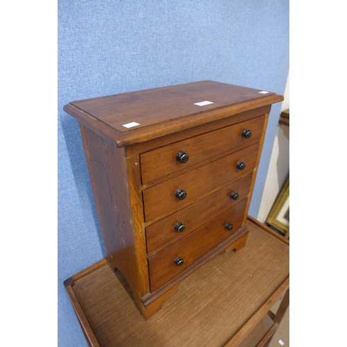 382 - A Victorian oak apprentice's/miniature chest of drawers