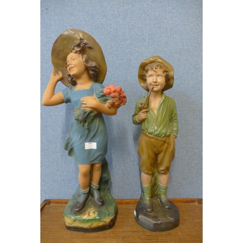 383 - A pair of 1930's plaster figures of a young girl and boy