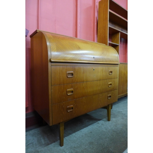 50 - A Swedish SMI teak cylinder top desk, designed by Egon Ostergaard