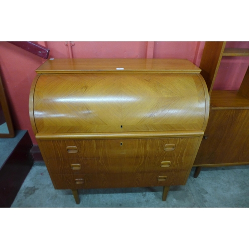 50 - A Swedish SMI teak cylinder top desk, designed by Egon Ostergaard