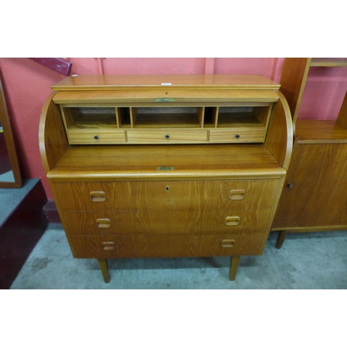 50 - A Swedish SMI teak cylinder top desk, designed by Egon Ostergaard