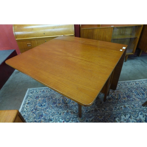 56 - A teak drop-leaf table