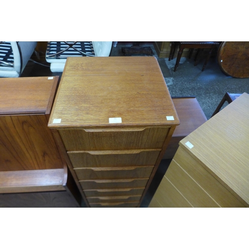 71 - A teak chest of drawers