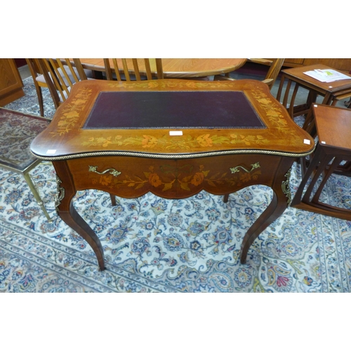 8 - A 19th Century French marquetry inlaid mahogany and gilt metal mounted writing table