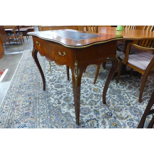 8 - A 19th Century French marquetry inlaid mahogany and gilt metal mounted writing table