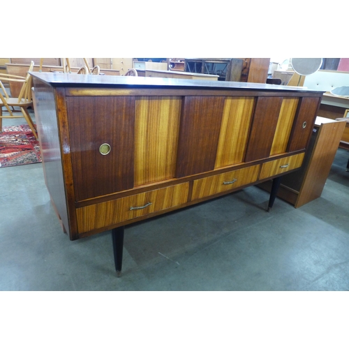 80 - A tola wood and afromosia sideboard