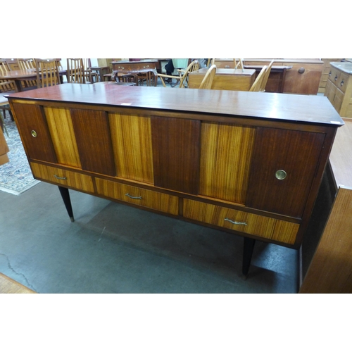 80 - A tola wood and afromosia sideboard